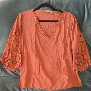 Women's Orange Top with Lace Sleeves